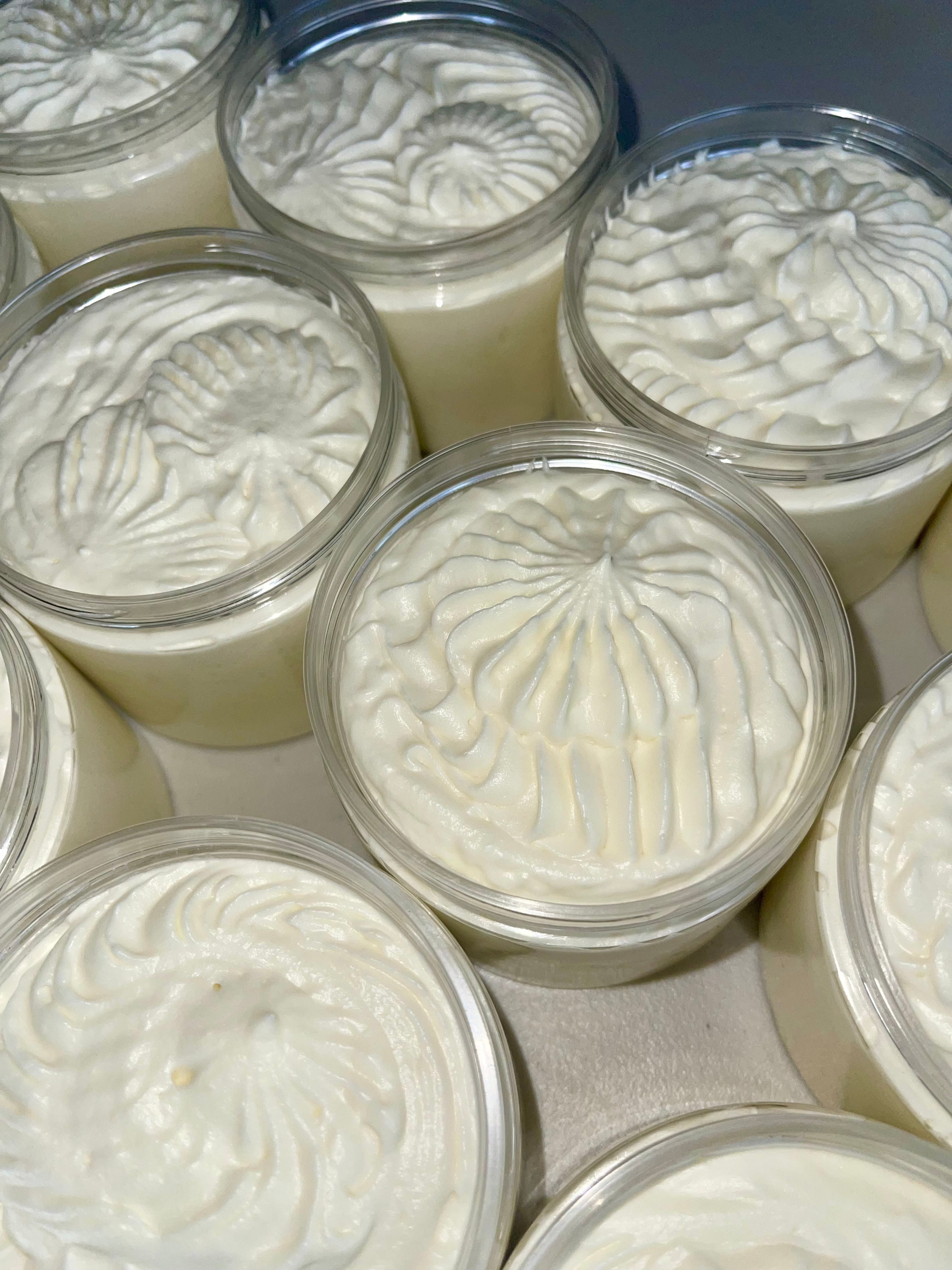 Multiple containers of whipped body butters with their textured tops
